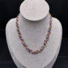 Collier Héliotrope – Éclats étoilés aux reflets d’améthyste